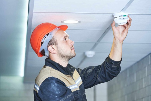 Red Line technician installing a fire alarm system
